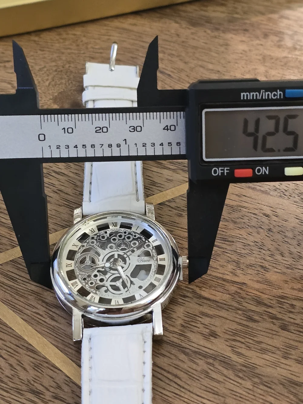 White Strap Silver-Tone Skeleton Mechanical Watch
